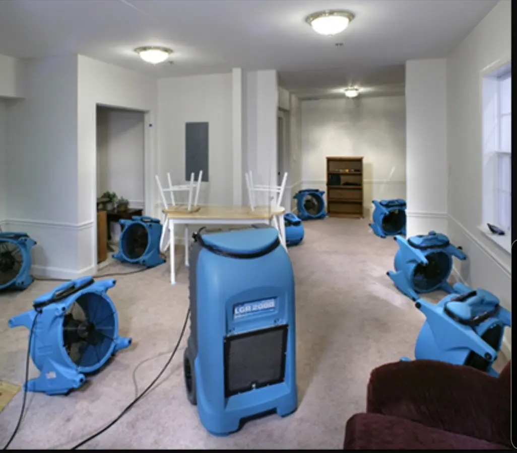 Air movers and dehumidifier setup for Water Damage Restoration in Midway